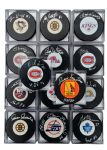 Past and Present Goalies Single-Signed Puck Collection of 26 with Roy and Hasek with COAs