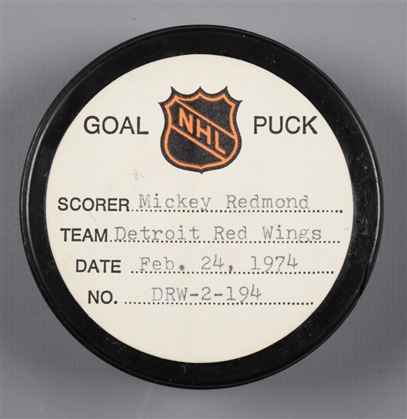 Mickey Redmonds Detroit Red Wings February 24th 1974 Goal Puck from the NHL Goal Puck Program - 38th Goal of Season / Career Goal #194 / 3rd Goal of Hat Trick