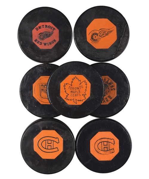 1958-68 "Original Six" Art Ross NHL Game Puck Collection of 7