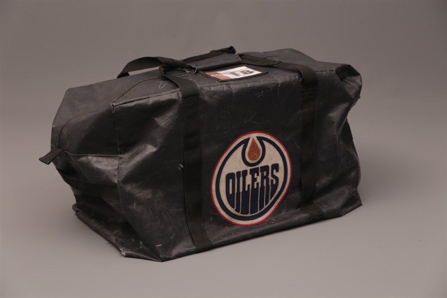 Edmonton Oilers Game-Worn Collection of 4 with Penners 2009-10 Gloves, Potulnys 2009-10 Gloves and Helmet and Moreaus 2006-08 Equipment Bag with Team LOAs - All Items Signed!