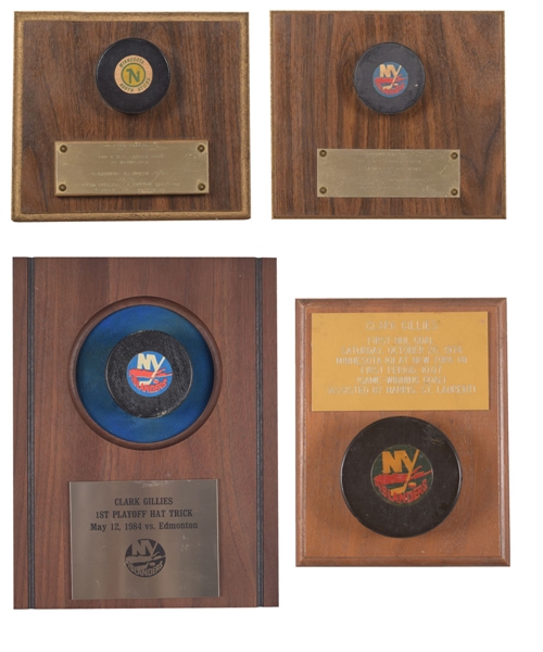 Clark Gillies New York Islanders Milestone Puck Collection of 4 Including 1st Career Goal, 100th Goal, 200th Point and 1984 Stanley Cup Finals Hat Trick Goal Puck with His Signed LOA