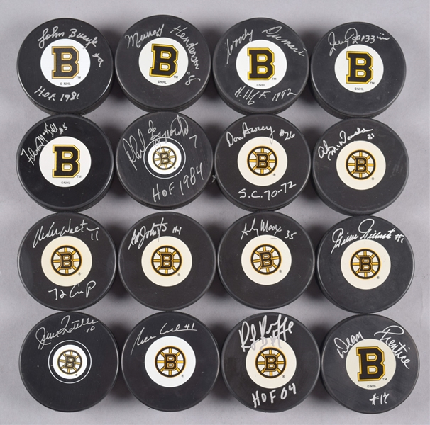 Boston Bruins Signed Puck Collection of 16 with 5 Hall of Fame Members Including Bourque, Dumart, Ratelle and Bucyk with LOA