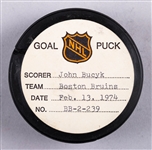 Johnny Bucyk’s Boston Bruins February 13th 1974 Goal Puck from the NHL Goal Puck Program - Season Goal #21 of 31 / Career Goal #456 of 556 - 3rd Goal of Hat Trick - Assisted by Bobby Orr