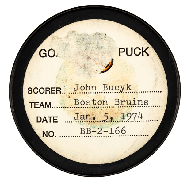 John Bucyks Boston Bruins January 5th 1974 Goal Puck from the NHL Goal Puck Program - Season Goal #14 of 31 / Career Goal #449 of 556 - 4th Goal of Game - Assisted by Bobby Orr