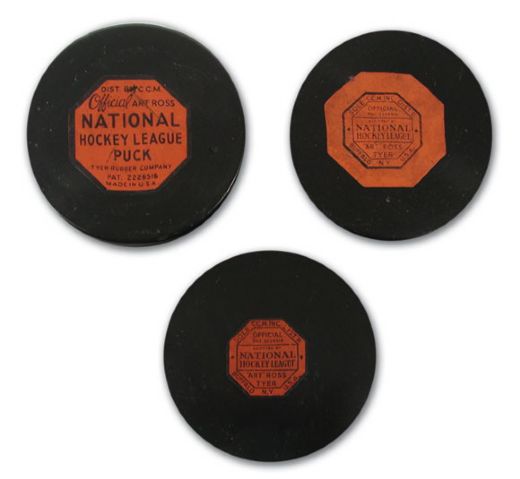 Collection of Three Rare Art Ross Tyer NHL Game Pucks