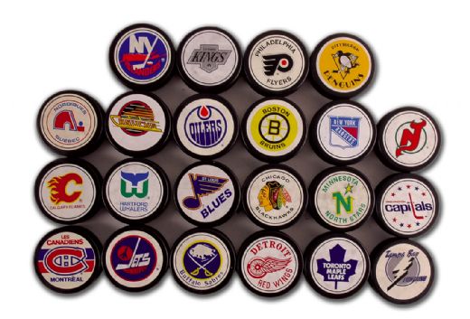 1980’s Ziegler (Large Logo) NHL Game Puck Collection of 22