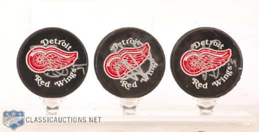 Detroit Red Wings Pucks Autographed by Yzerman, Larionov & Federov