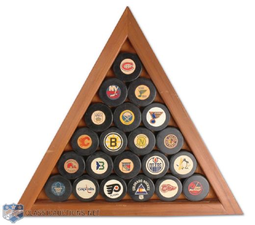 Jacques Laperriere’s NHL Official Game Puck Wood Frame and Assorted Minor League Pucks