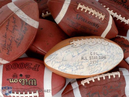 Tony Gabriels Football Collection of 11, Including 1974 CFL All-Star Game Team Signed Football