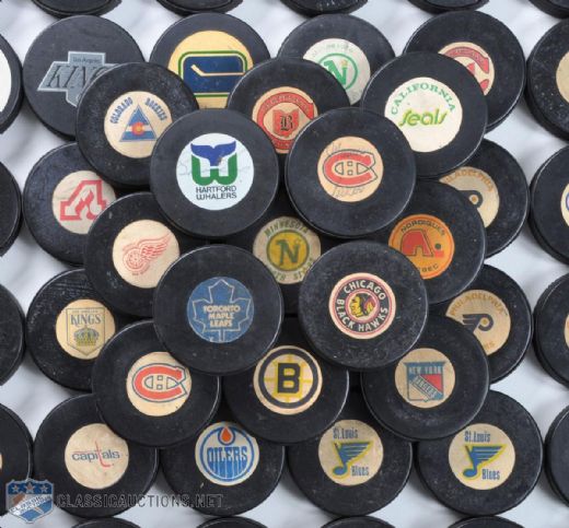 NHL Team Puck Collection of 49 Featuring NHL Viceroy Game Puck Collection of 44, Including Maurice Richard and Gordie Howe Signed Pucks