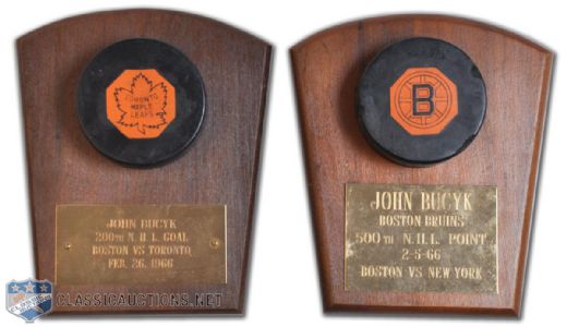 Johnny Bucyks 1966 Milestone 200th Goal and 500th Point Puck Collection of 2