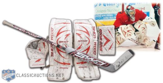 Kim St-Pierres 2010 Olympics Game-Used Blocker, Trapper and Photo-Matched Pads + Game-Used Stick