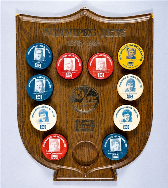 Winnipeg Jets WHA 1975-76 Biltrite Coloured Puck Collection of 10 on Original Easel-Back Display