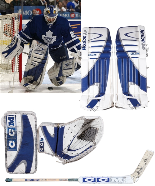 Ed Belfours Toronto Maple Leafs 2002-03 CCM Game-Used Glove and Blocker, 2005-06 CCM Game-Used Stick Plus 2003-04 Game-Issued CCM Heaton Goalie Pads and More with His Signed LOA