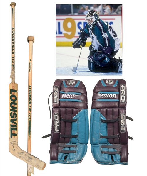 Guy Heberts Mid-1990s Anaheim Mighty Ducks Game-Worn Heaton Goalie Pads and Signed Louisville Game-Used Stick