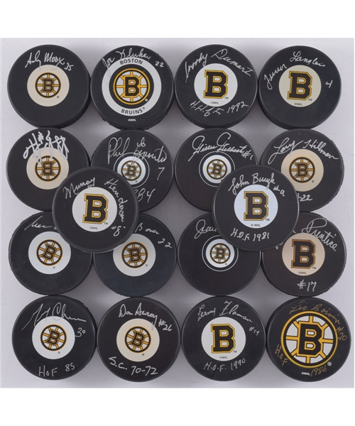 Boston Bruins Signed Puck Collection of 18 with 8 Hall of Fame Members Including Bourque, Dumart, Flaman and Bucyk with LOA