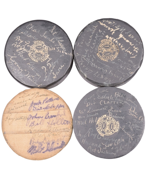Boston Bruins 1930s/1940s Team-Signed Official NHL Spalding Hockey Puck Collection of 4 with LOA Including 1938-39 and 1940-41 Stanley Cup Champions Team-Signed Pucks!