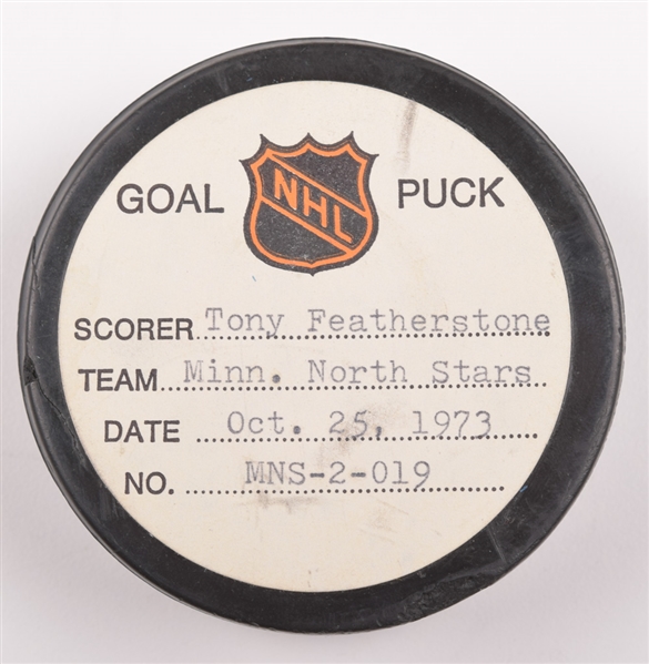 Tony Featherstones Minnesota North Stars October 25th 1973 Goal Puck from the NHL Goal Puck Program - 1st Goal of Season / Career Goal #1
