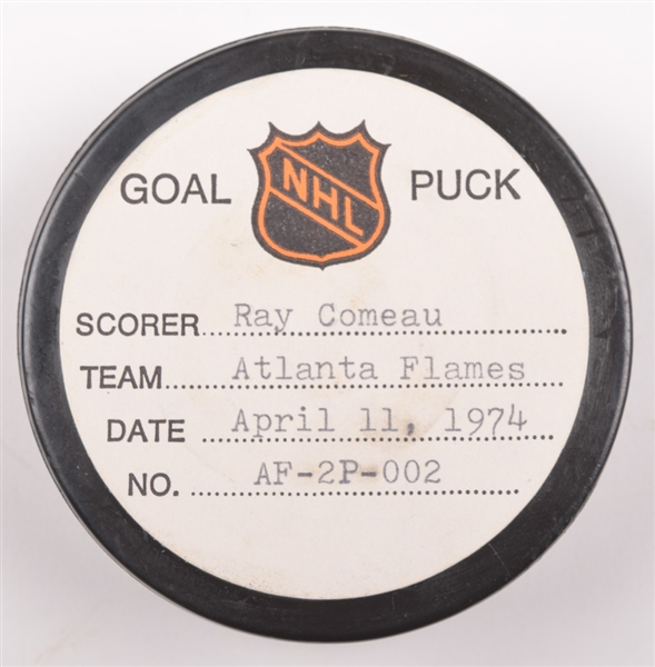 Rey Comeaus Atlanta Flames April 11th 1974 Playoff Goal Puck from the NHL Goal Puck Program - 1st Playoff Goal of Season / Career Playoff Goal #1