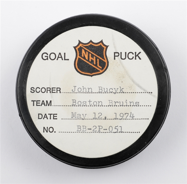 Johnny Bucyks Boston Bruins May 12th 1974 Stanley Cup Finals Goal Puck from the NHL Goal Puck Program - 8th Playoff Goal of Season / Career Playoff Goal #38 of 41 - Assisted by Bobby Orr