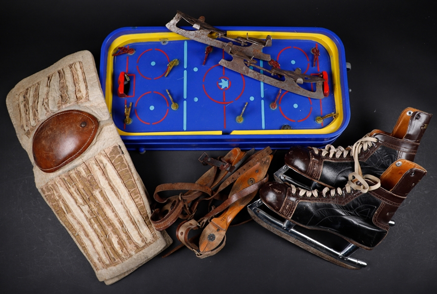 Vintage Hockey Equipment Collection Including Leather Goalie Pads, Vintage Skates, Stick and Foster Hewitt Hockey Game