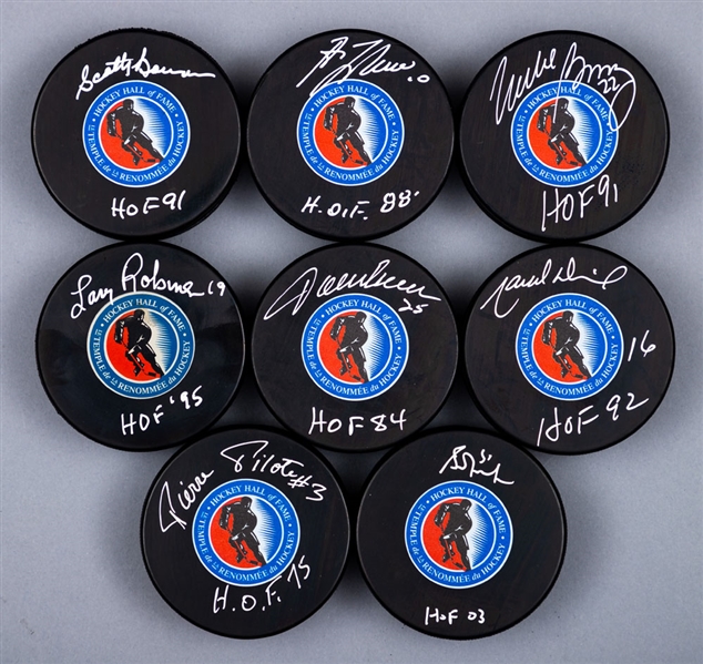Hockey Hall of Fame Single-Signed Puck Collection of 8 with LOA Including Bossy, Lafleur, Dionne, Robinson and Others