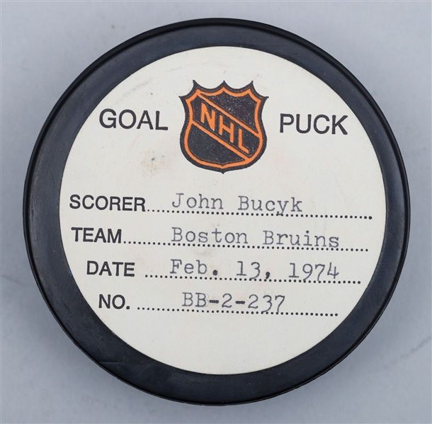 Johnny Bucyks Boston Bruins February 13th 1974 Goal Puck from the NHL Goal Puck Program - 20th Goal of Season / Career Goal #455 of 556 - 2nd Goal of Hat Trick