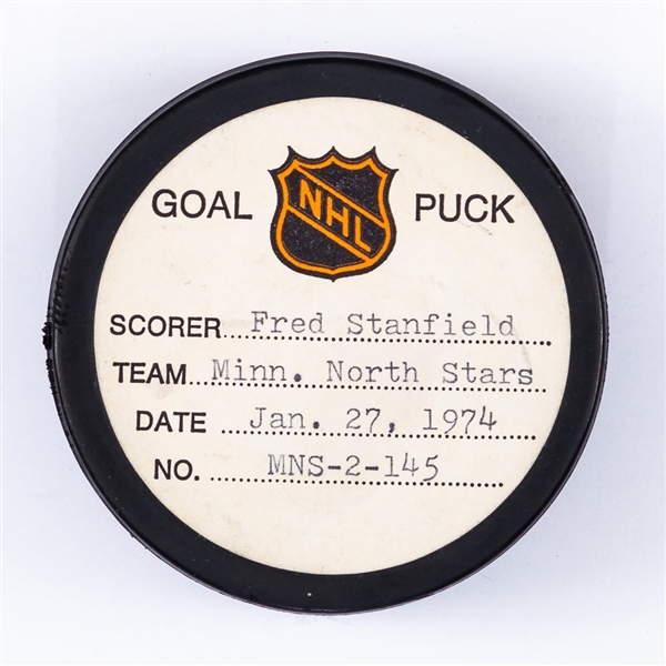 Fred Stanfields Minnesota North Stars January 27th 1974 Goal Puck from the NHL Goal Puck Program - Season Goal #13 of 16 / Career Goal #158 of 211 - Game-Tying Goal