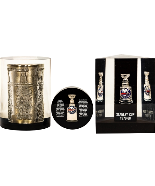 Bryan Trottiers 1979-80, 1980-81 and 1982-83 NY Islanders Stanley Cup Champions Lucite Displays (3) and 1981 Stanley Cup Mugs (9) from His Personal Collection with His Signed LOA