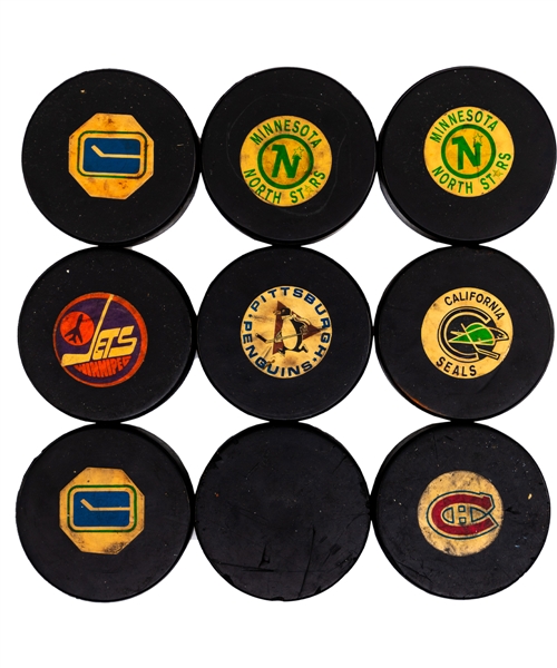 1967-83 NHL Game Puck Collection of 9 Including 1967-68 Art Ross Converse Expansion Teams Pucks (4)