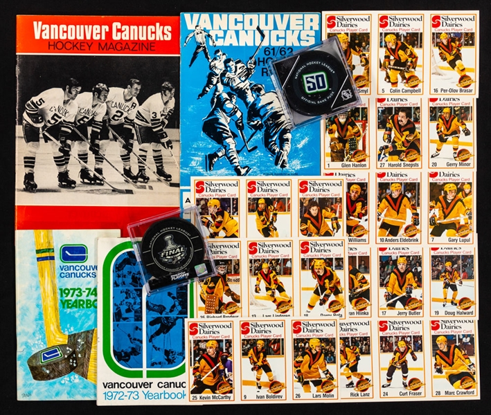 Vancouver Canucks Memorabilia Collection Including Early-1970s Media Guides, 1970s Souvenir Team Pucks and Assorted Items