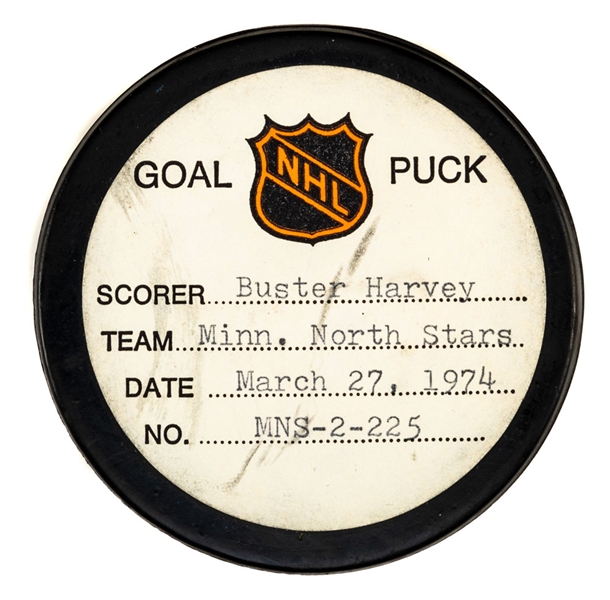 Buster Harveys Minnesota North Stars March 27th 1974 Goal Puck from the NHL Goal Puck Program - Season Goal #16 of 16 / Career Goal #49 of 90
