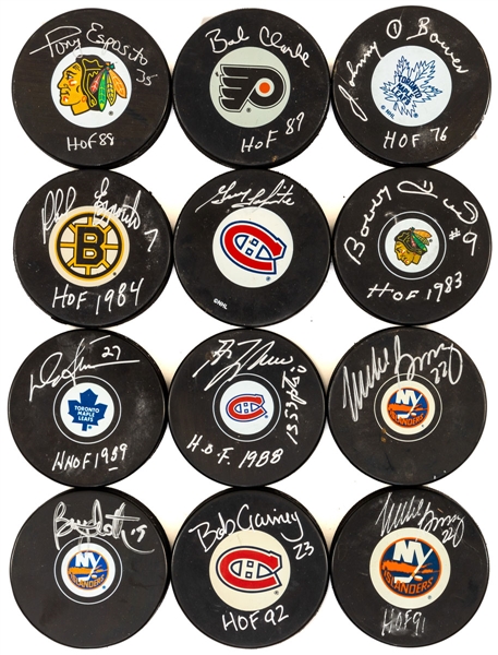 Hockey HOFers Single-Signed Hockey Puck Collection of 12 Including Esposito Bros, Bossy, Trottier, Lafleur, Bower, Sittler, Clark and Others