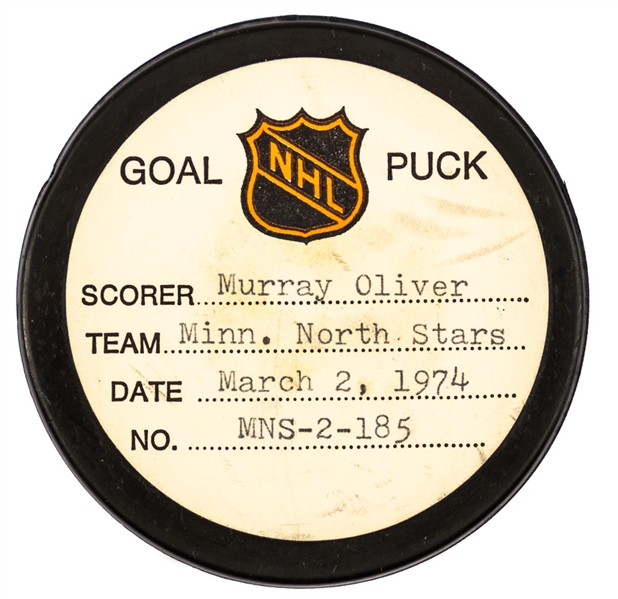 Murray Oliver’s Minnesota North Stars March 2nd 1974 Goal Puck from the NHL Goal Puck Program - Season Goal #13 of 17 / Career Goal #251 of 274