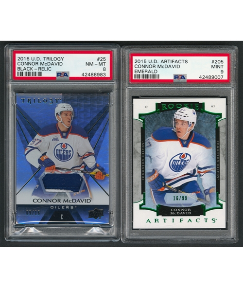 2015-16 UD Artifacts Emerald Hockey Card #205 Connor McDavid Rookie (16/99)(PSA 9 - Pop-4 - Highest-Graded) and 2016-17 UD Trilogy Rainbow Black Relic Card #25 Connor McDavid Patch (09/16)(PSA 8)