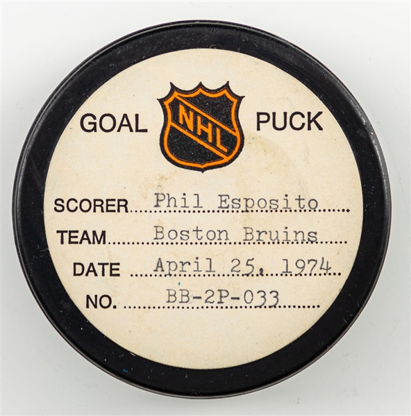 Phil Espositos Boston Bruins April 25th 1974 Playoff Goal Puck from the NHL Goal Puck Program - Season PO Goal #4 of 9 / Career PO Goal #41 of 61 - Game-Winning Goal