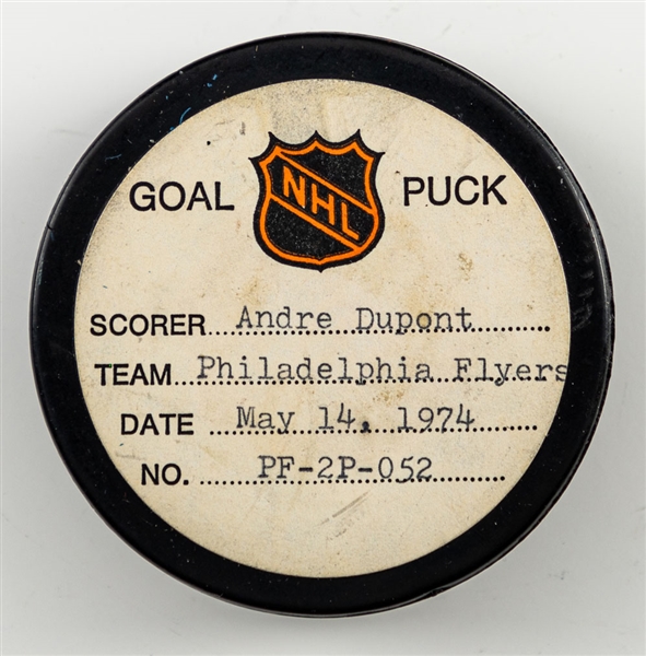 Andre Duponts Philadelphia Flyers May 14th 1974 Stanley Cup Finals Goal Puck from the NHL Goal Puck Program - Season PO Goal #4 of 4 / Career PO Goal #6 of 14 - Assisted by Bobby Clarke 