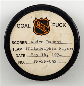 Andre Duponts Philadelphia Flyers May 14th 1974 Stanley Cup Finals Goal Puck from the NHL Goal Puck Program - Season PO Goal #4 of 4 / Career PO Goal #6 of 14 - Assisted by Bobby Clarke 