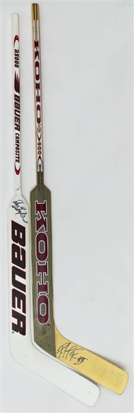 Patrick Roy (Avalanche) and Dominik Hasek (Sabres) Signed Game-Issued Sticks Plus 2002 and 2006 NHL Olympic Media Guides Signed by 8 Including Hasek, Brodeur and Fedorov 