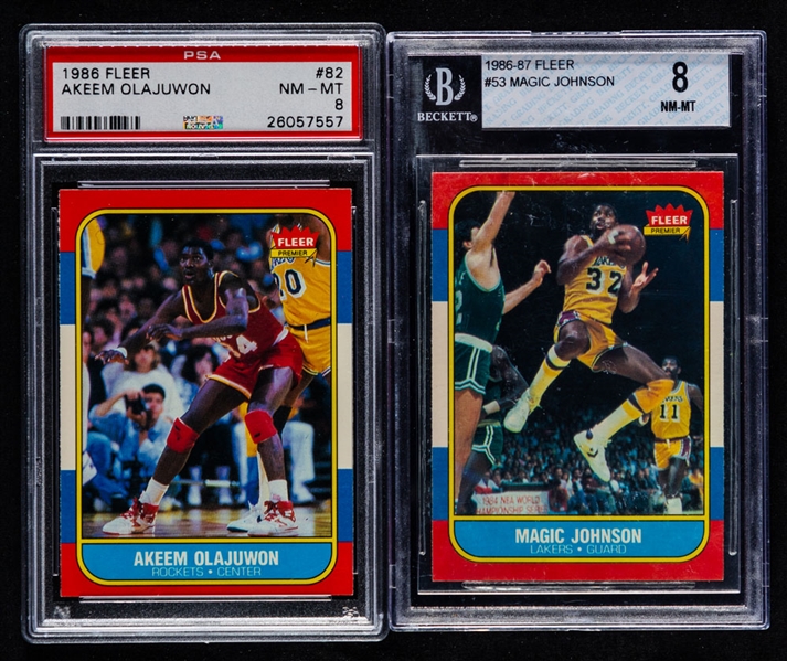 1986-87 Fleer Basketball Card #82 Akeem Olajuwon Rookie (Graded PSA 8) and #53 Magic Johnson (Graded Beckett 8)