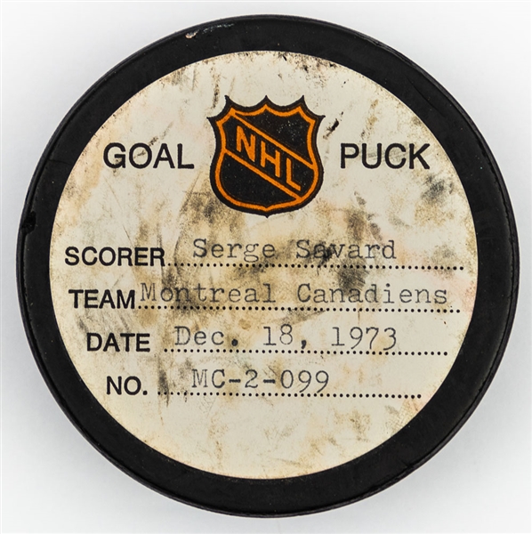 Serge Savard’s Montreal Canadiens December 18th 1973 Goal Puck from the NHL Goal Puck Program – 3rd Goal of Season / Career Goal #38 of 106