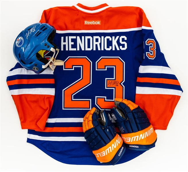 Matt Henricks’ 2014-15 Edmonton Oilers Signed Bauer Game-Used Helmet and Signed Winnwell Game-Used Gloves Plus 2015-16 “Hockey Fights Cancer” Game-Issued Jersey – LOAs 