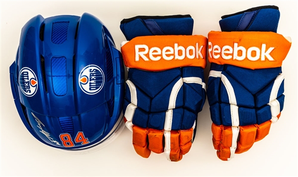 Oscar Klefbom’s 2013-14 Edmonton Oilers Signed Reebok Game-Worn Helmet (Photo-Matched) and Signed Reebok Game-Used Gloves with Team LOA 