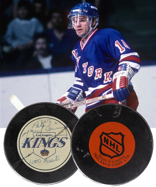 Marcel Dionnes November 7th 1987 1,000th NHL Regular Season Assist Milestone Puck Gifted to Kings Trainer Pete Demers with Demers Signed LOA