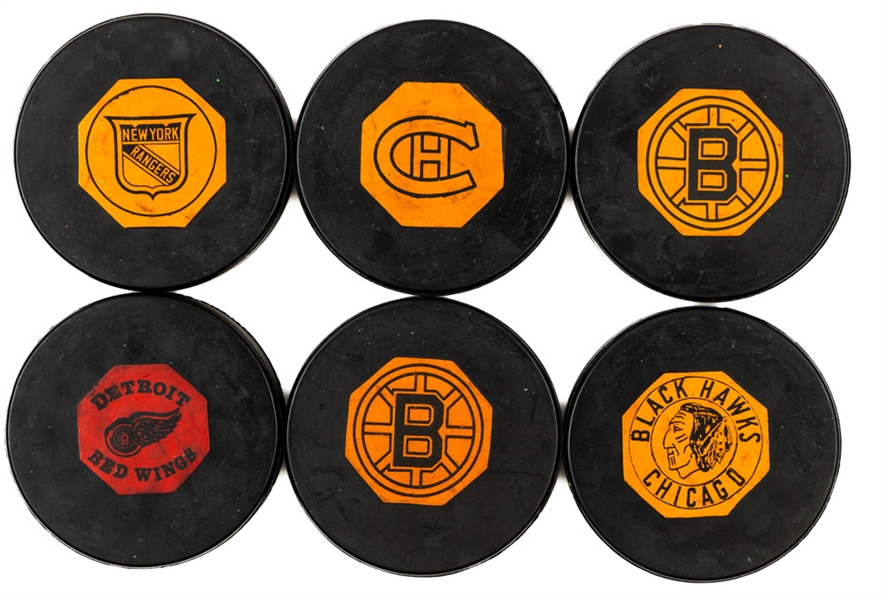 1958 to 1969 Art Ross NHL Game Pucks (13) Inc. 1958-62 Original Six Chicago Black Hawks and Detroit Red Wings and 1964-67 Original Six New York Rangers and Montreal Canadiens