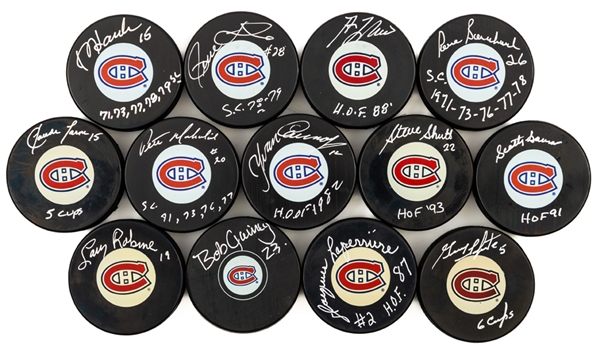 Montreal Canadiens 1970s Dynasty Signed Puck Collection of 13 Including HOFers Lapointe, Laperriere, Lafleur, Gainey, Cournoyer, Shutt, Robinson and Bowman with LOA