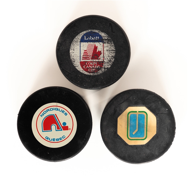 1991 Canada Cup Game-Used Puck from Canada vs Sweden Semifinals September 12th 1991 Plus 1972-75 Vancouver Canucks Converse and 1994 Quebec Nordiques InGlasCo Pucks