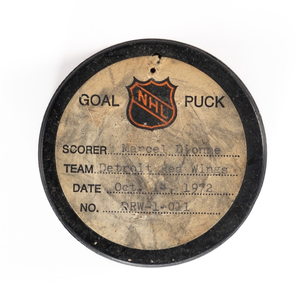 Marcel Dionnes Detroit Red Wings October 14th 1972 Goal Puck from the NHL Goal Puck Program - Season Goal #3 of 40 / Career Goal #31 of 731
