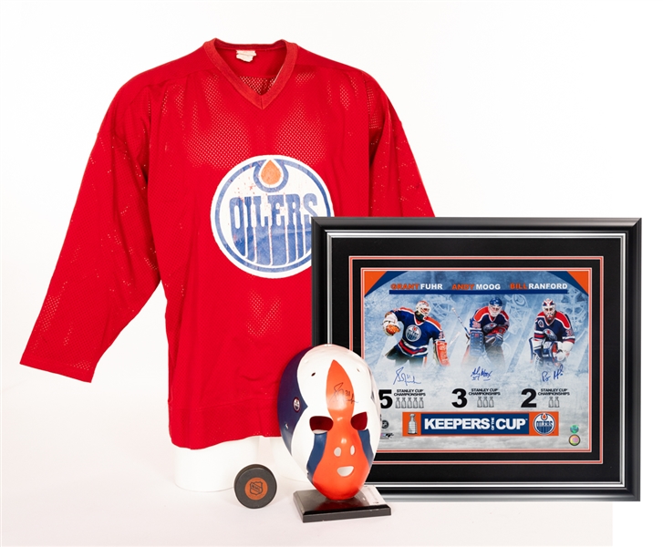 Edmonton Oilers 1980s Dynasty Collection of 4 Including "Keepers of the Cup" Signed Frame, Grant Fuhr Signed Replica Rookie Mask, Early-1980s Practice-Worn Jersey and More