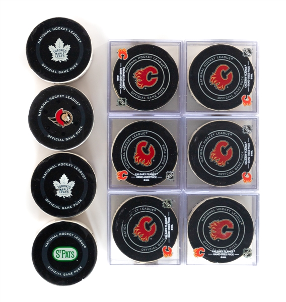 Calgary Flames 2018 to 2022 Game-Used Goal Puck Collection of 10 - All With COAs! 
